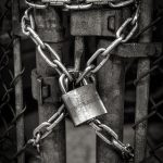 gray steel chain locked on gate